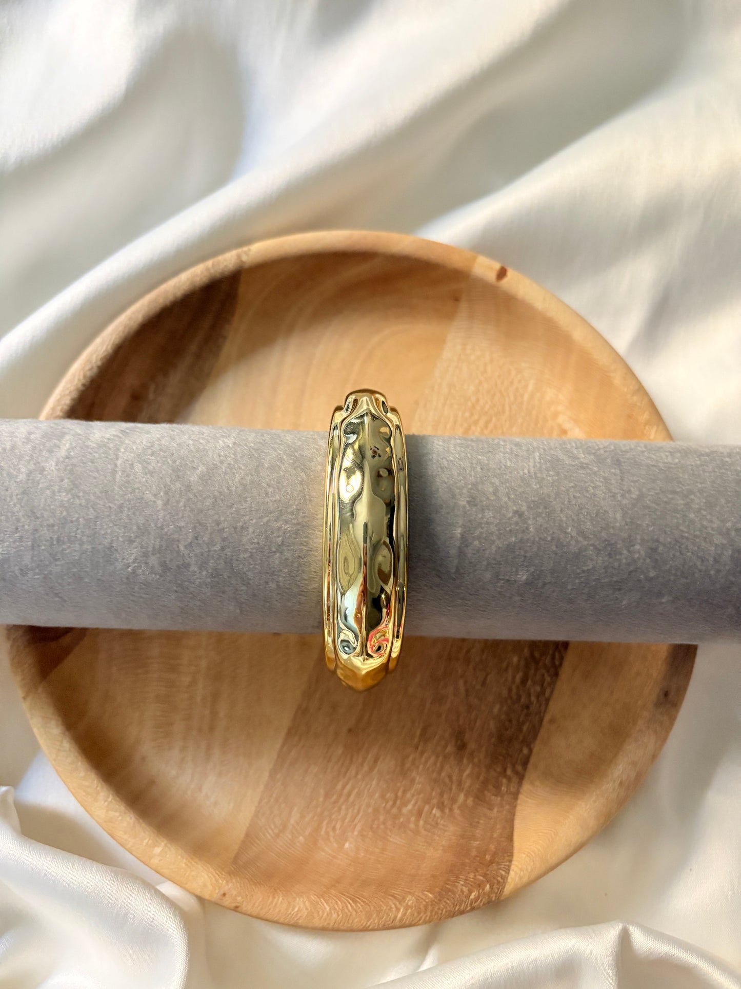 Gold statement bangle