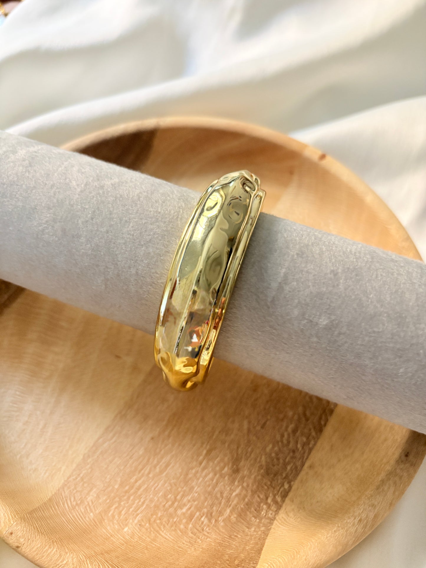 Gold statement bangle
